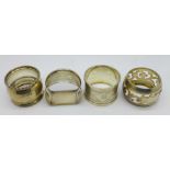 Four silver napkin rings, 76.