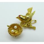 A hallmarked 9ct gold bird brooch,