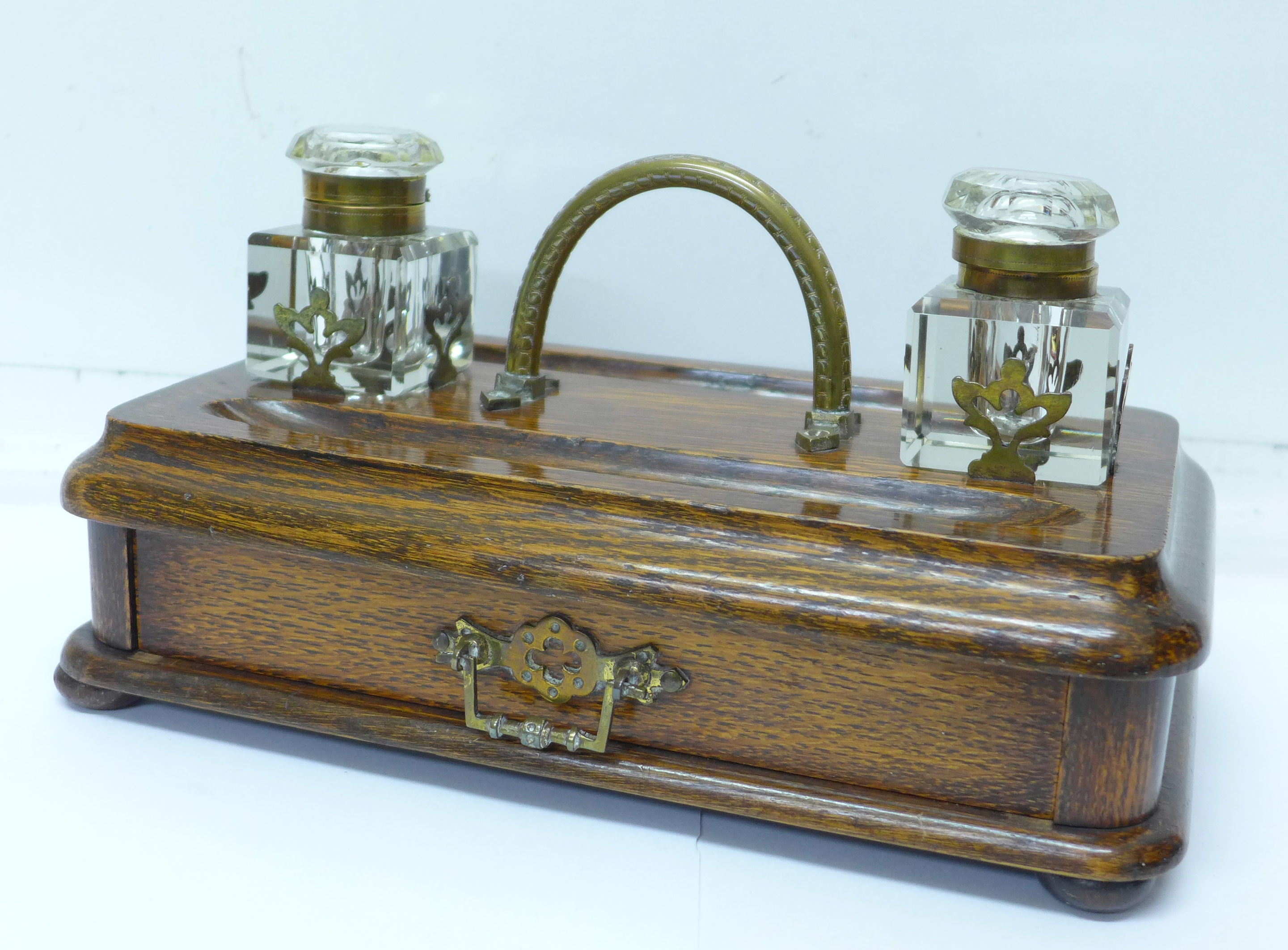 An oak standish with drawer, one inkwell a/f,