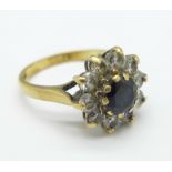 A 9ct gold, blue and white stone cluster ring, 3.