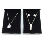 Two silver pendants and chains, necklaces,