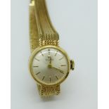 A lady's 9ct gold Tissot wristwatch, total weight 15.
