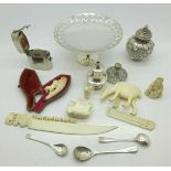 A small silver pepper, one other pepper a/f, a small plated comfort, a carved ivory figure,