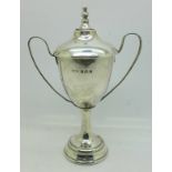A lidded silver trophy,