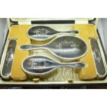 A silver and tortoiseshell five piece vanity set,