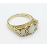 A 9ct gold, opal and white stone ring, 3.