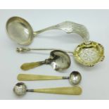 A silver ladle, sifting spoon,