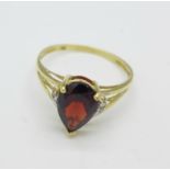 A 9ct gold, garnet and diamond chip ring, 1.