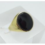 A 9ct gold and onyx ring, 2.