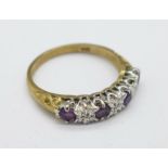 A 9ct gold, diamond and purple stone ring, 2g,