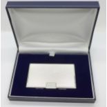 A silver card case, boxed,