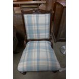 An Edward VII mahogany and upholstered nursing chair