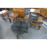 A teak nest of tables and four occasional tables