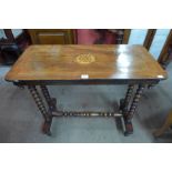 A Victorian inlaid walnut stretcher table