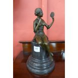 A bronze figure of a lady holding a mirror,