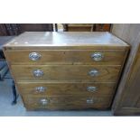 An oak four drawer chest of drawers