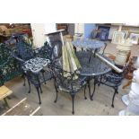 A cast alloy garden table, six chairs,