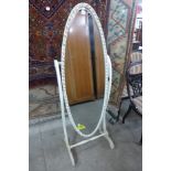 A cream and parcel gilt cheval mirror