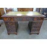 A mahogany pedestal desk