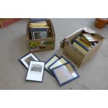 Two boxes of assorted prints and picture frames