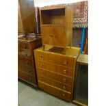 An oak chest of drawers and a bedside table