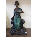 A French Art Deco bronze figure of a seated girl playing tambourine,