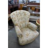 A Victorian style floral upholstered armchair