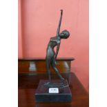 A bronze figure of a female nude,