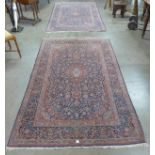 A pair of blue ground rugs,