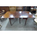 A George IV mahogany concertina action extending dining table