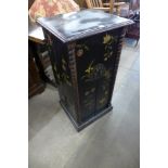 A Chinese lacquered cupboard
