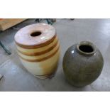 A stoneware barrel and a terracotta vase