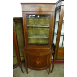 An Edward VII inlaid mahogany bow front display cabinet