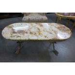 A brass and onyx topped coffee table