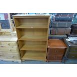 A teak open bookcase and a bedside chest