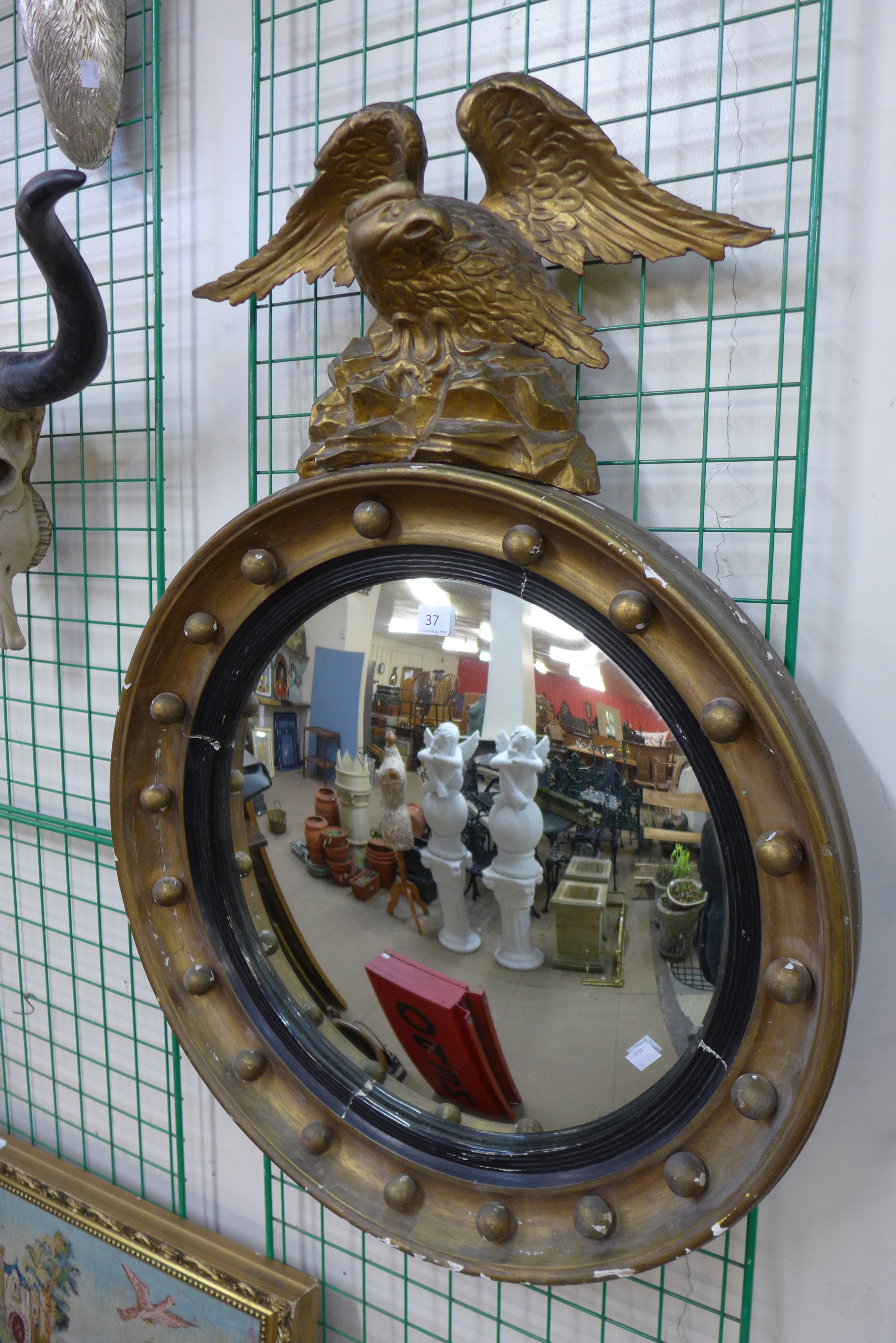 A Regency giltwood convex mirror