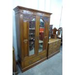 A Victorian carved walnut wardrobe and dressing chest