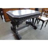 A Victorian Jacobean Revival carved oak octagonal centre table