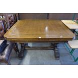 An oak draw leaf table