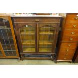 An oak barleytwist two door bookcase