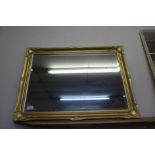 A gilt framed mirror