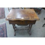 A 19th Century French walnut sewing table