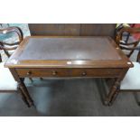 A Victorian mahogany two drawer writing table