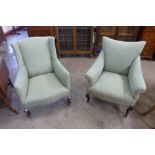 Two similar Edward VII mahogany and upholstered armchairs