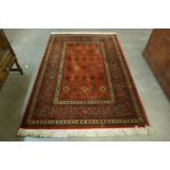 A Royal Keshan terracotta ground rug,