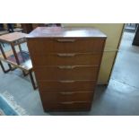 A teak chest of drawers