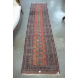 A red ground runner rug,