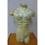 A bronze male torso
