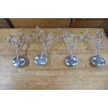 A set of four chrome and cut glass wall lights