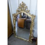 A rococo style gilt framed mirror
